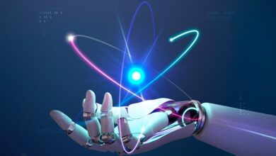 A robotic hand reaching toward a glowing, atom-like light structure on a dark background